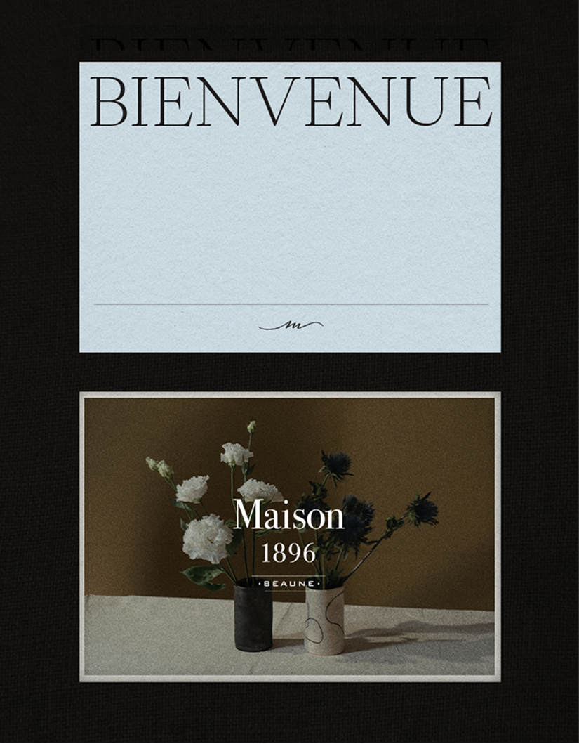 Bienvenue postcard and Maison 1896 photo card on black surface