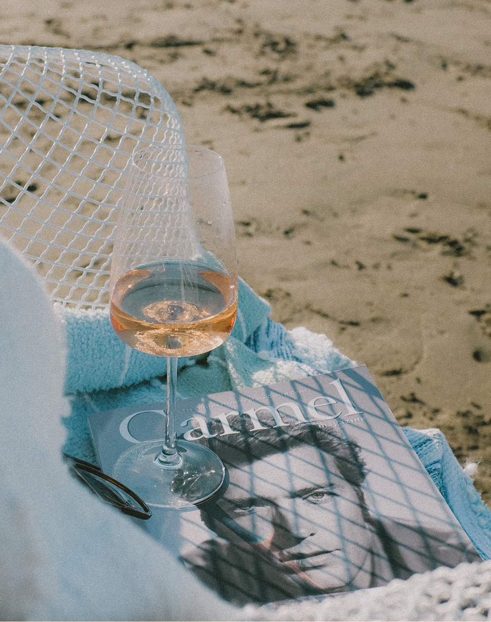 Carmel Beach Hotel — beach picnic with magazine